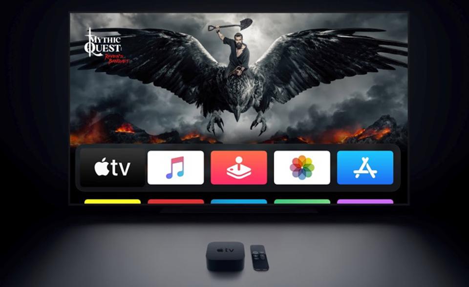 https specials images.forbesimg.com imageserve 6026e0264a03e02ce10fa416 tvOS Home Screen showing on a TV with the Apple TV box